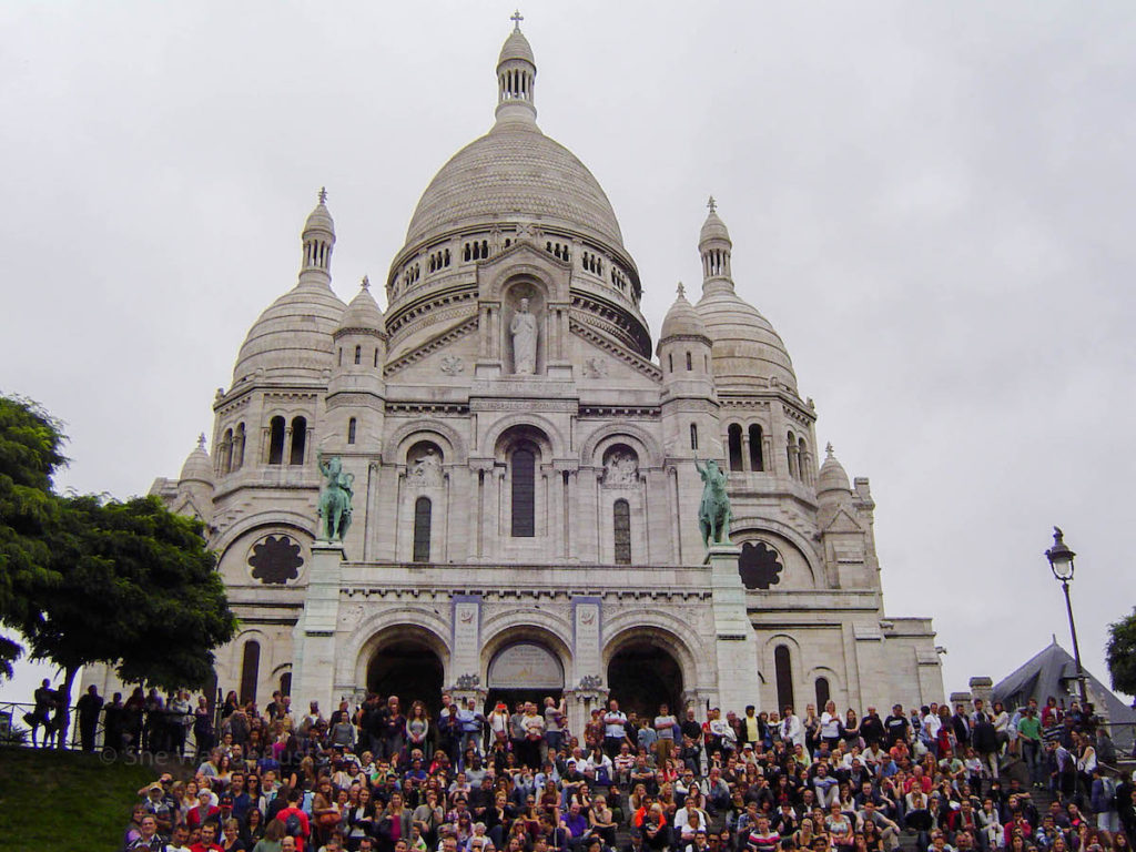 People sitting in front of Basilica Sacre-Coeur