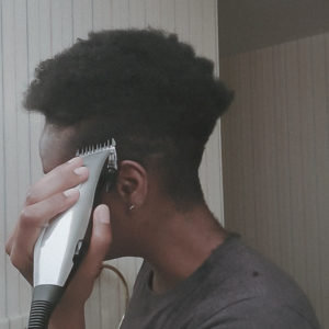 Black girl cuts her own hair short